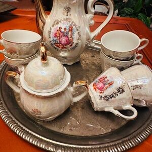 Vintage Porcelain Tea Set with Gold Accents and Romantic Decal with music